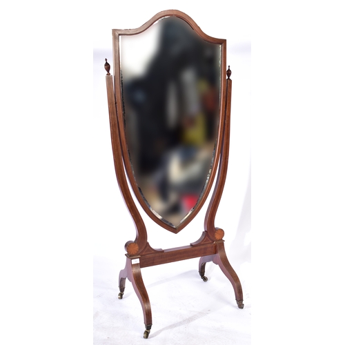 395 - A late Victorian 19th century mahogany inlaid cheval swing floor mirror. The mirror having a shield ... 