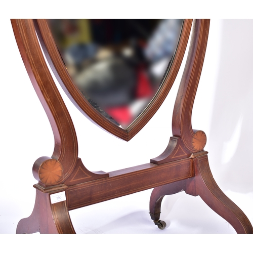 395 - A late Victorian 19th century mahogany inlaid cheval swing floor mirror. The mirror having a shield ... 