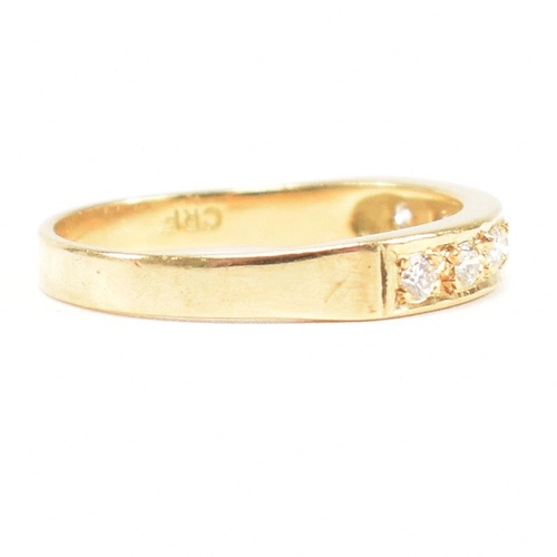 100 - A hallmarked 18ct gold and diamond seven stone ring. Estimated diamond weight 0.30ct. Hallmarked Lon... 