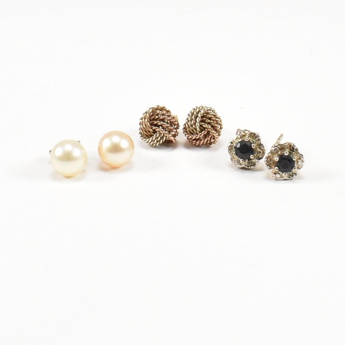 104 - Three pairs of gold earrings. The earrings to include knot marked 375. Cultured pearl unmarked. Sapp... 