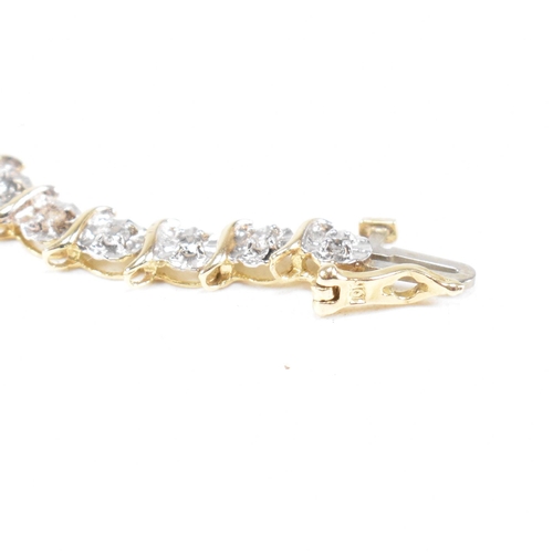 106 - A 9ct gold and diamond line bracelet.  Weight 6.1g / Measures 17.5cm. Marked 10k. All weights, measu... 