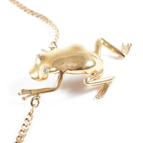 108 - A 9ct gold frog pendant necklace. The necklace strung with a large frog pendant having diamond set e... 