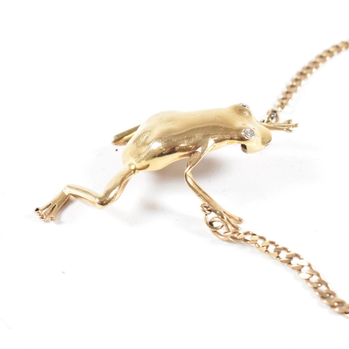 108 - A 9ct gold frog pendant necklace. The necklace strung with a large frog pendant having diamond set e... 