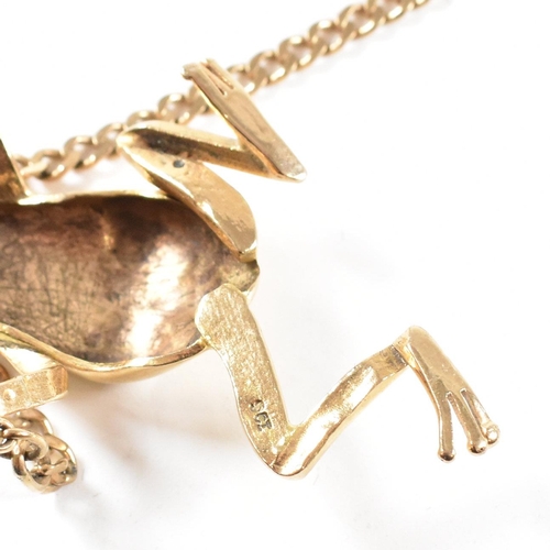 108 - A 9ct gold frog pendant necklace. The necklace strung with a large frog pendant having diamond set e... 