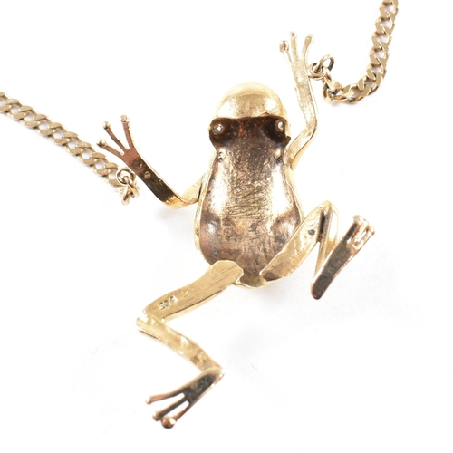 108 - A 9ct gold frog pendant necklace. The necklace strung with a large frog pendant having diamond set e... 