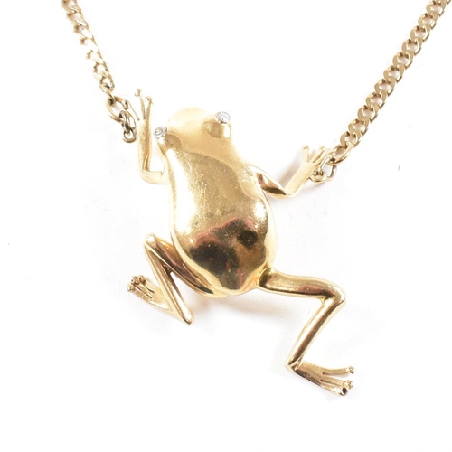 108 - A 9ct gold frog pendant necklace. The necklace strung with a large frog pendant having diamond set e... 