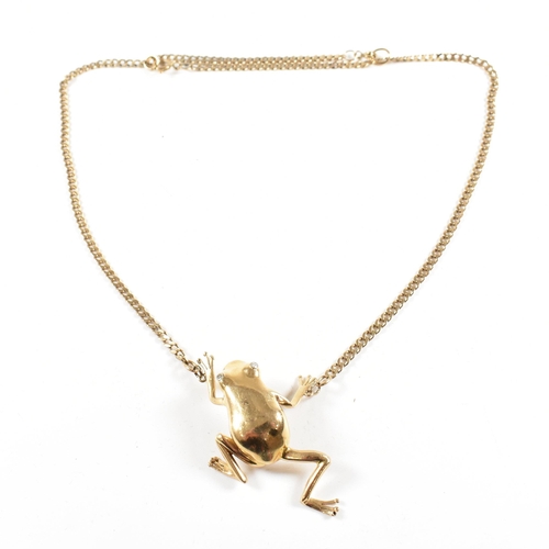 108 - A 9ct gold frog pendant necklace. The necklace strung with a large frog pendant having diamond set e... 