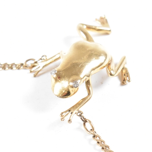 108 - A 9ct gold frog pendant necklace. The necklace strung with a large frog pendant having diamond set e... 