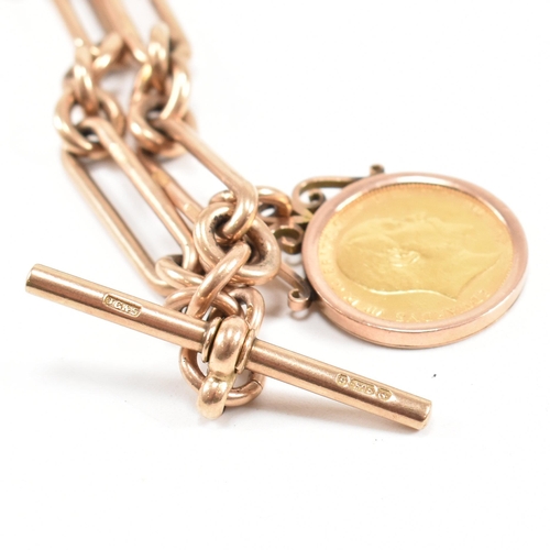 11 - A hallmarked 9ct gold Albert watch chain and sovereign fob. The Albert chain formed with chain and o... 