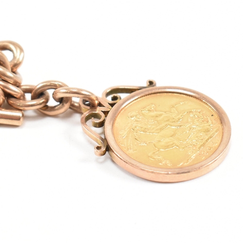 11 - A hallmarked 9ct gold Albert watch chain and sovereign fob. The Albert chain formed with chain and o... 