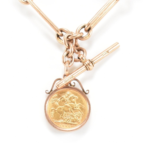 11 - A hallmarked 9ct gold Albert watch chain and sovereign fob. The Albert chain formed with chain and o... 