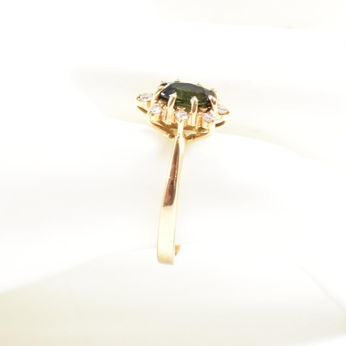 110 - Hallmarked 18ct gold tourmaline and diamond cluster ring. Weight 3.2g. Size J. All weights, measurem... 