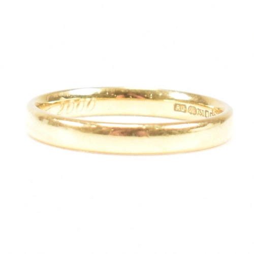 111 - A hallmarked 18ct gold band ring. The band ring inscribed Kevin & Helen 5th Feb 2000. Weight 3.2g. S... 