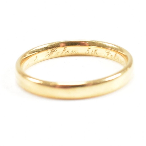 111 - A hallmarked 18ct gold band ring. The band ring inscribed Kevin & Helen 5th Feb 2000. Weight 3.2g. S... 