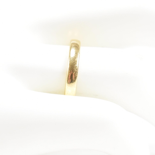 111 - A hallmarked 18ct gold band ring. The band ring inscribed Kevin & Helen 5th Feb 2000. Weight 3.2g. S... 