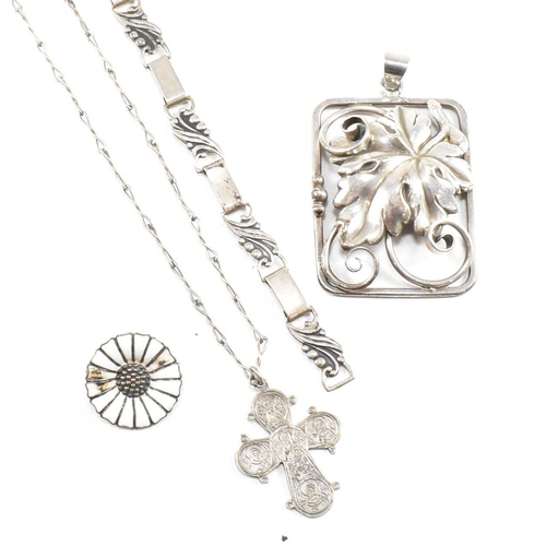 112 - A collection of Danish silver and white metal jewellery. The jewellery to include a leaf and berry b... 