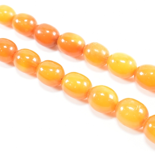 117 - A vintage butterscotch amber bead necklace. The necklace strung with graduating beads from 1.8cm to ... 