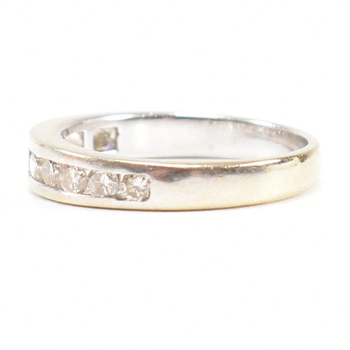 119 - A 18ct gold and diamond half eternity ring. Estimated diamond weight 0.50ct. Marked 750. Weight 2.6g... 