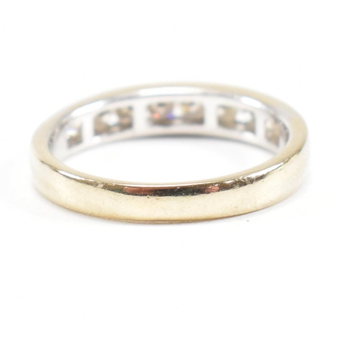 119 - A 18ct gold and diamond half eternity ring. Estimated diamond weight 0.50ct. Marked 750. Weight 2.6g... 