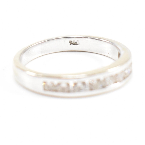 119 - A 18ct gold and diamond half eternity ring. Estimated diamond weight 0.50ct. Marked 750. Weight 2.6g... 