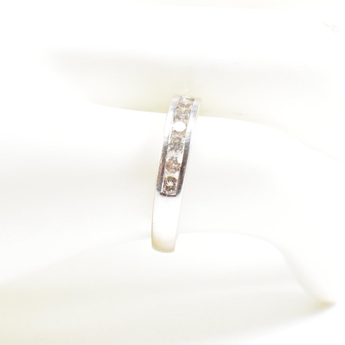 119 - A 18ct gold and diamond half eternity ring. Estimated diamond weight 0.50ct. Marked 750. Weight 2.6g... 