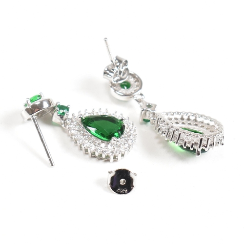 127 - A pair of contemporary 925 silver and cubic zirconia and faux emerald earrings. Weight approx 4.6g. ... 