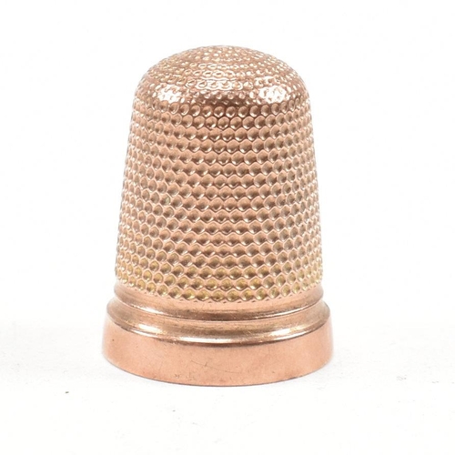 128 - A hallmarked 9ct gold cased thimble. The thimble hallmarked Birmingham 1919, maker HC&S. Weight 4.3g... 