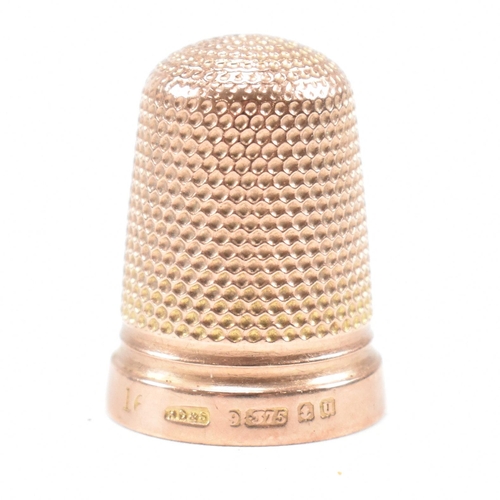 128 - A hallmarked 9ct gold cased thimble. The thimble hallmarked Birmingham 1919, maker HC&S. Weight 4.3g... 