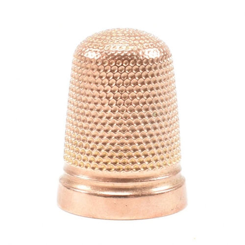 128 - A hallmarked 9ct gold cased thimble. The thimble hallmarked Birmingham 1919, maker HC&S. Weight 4.3g... 