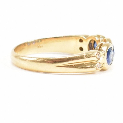 13 - An 18ct gold sapphire and diamond three stone ring. The ring set with three oval cut sapphires havin... 