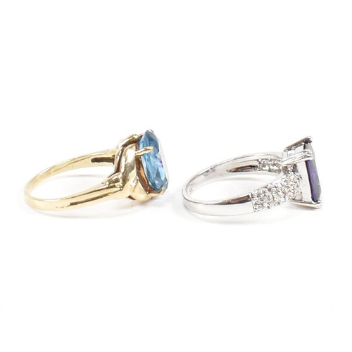 130 - Two 9ct gold dress rings. The rings to include a purple and white CZ set ring, size O. A hallmarked ... 