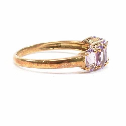 136 - A hallmarked 9ct gold and amethyst five stone ring. Weight 2.2g. Size O.5. All weights, measurements... 