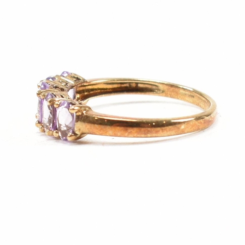 136 - A hallmarked 9ct gold and amethyst five stone ring. Weight 2.2g. Size O.5. All weights, measurements... 