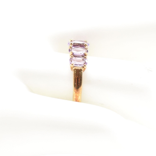 136 - A hallmarked 9ct gold and amethyst five stone ring. Weight 2.2g. Size O.5. All weights, measurements... 