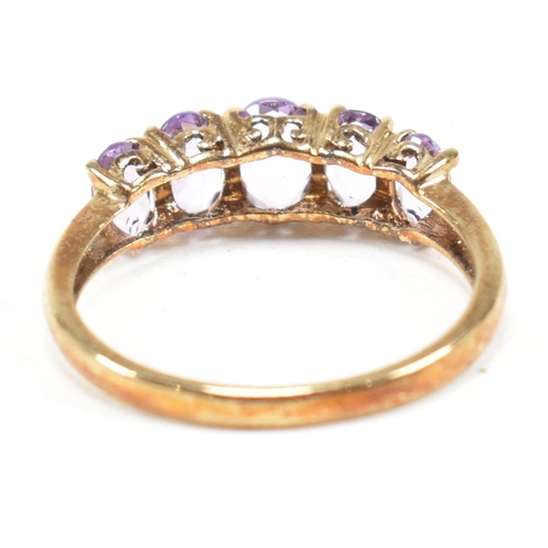 136 - A hallmarked 9ct gold and amethyst five stone ring. Weight 2.2g. Size O.5. All weights, measurements... 