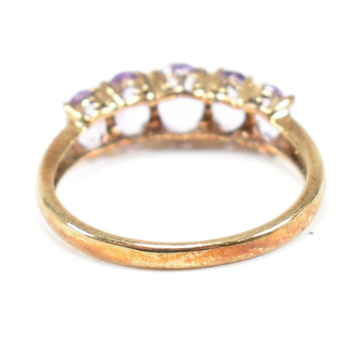 136 - A hallmarked 9ct gold and amethyst five stone ring. Weight 2.2g. Size O.5. All weights, measurements... 