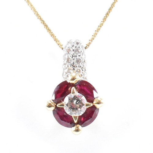 14 - A Raima Italian 18ct gold ruby and diamond pendant necklace. The necklace strung with a ruby and dia... 