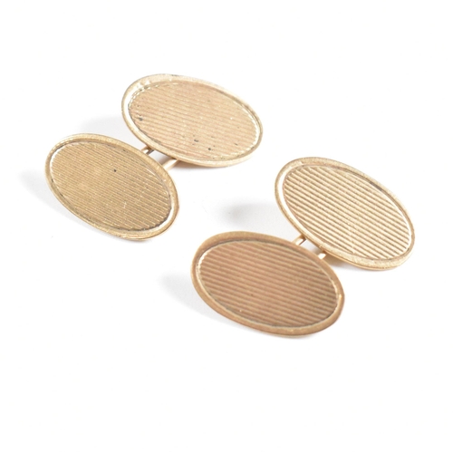 144 - A pair of 9ct gold cufflinks. The cufflinks in oval form. Stamped 9ct to ovals, and link. Weight 7g.... 