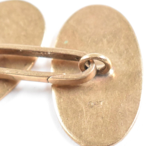 144 - A pair of 9ct gold cufflinks. The cufflinks in oval form. Stamped 9ct to ovals, and link. Weight 7g.... 