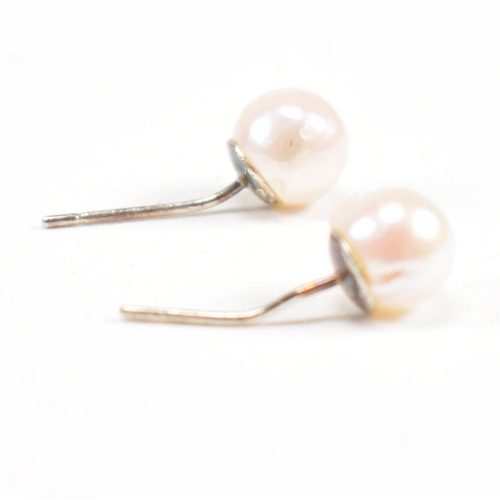 153 - A pair of freshwater pearl and 925 silver earrings. Weight approx 0.7g. Measures approx 0.5cm. All w... 