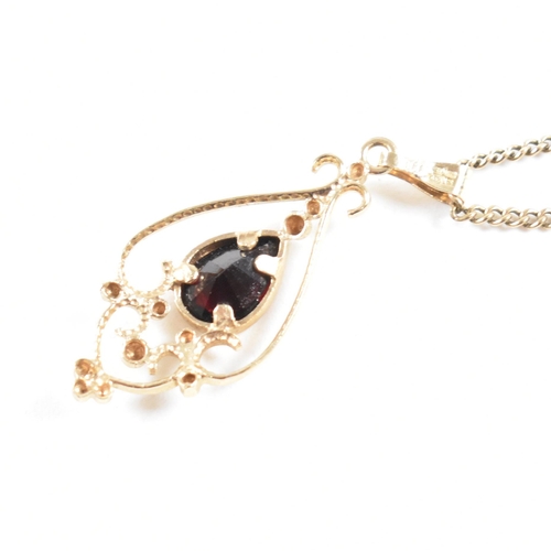 155 - A contemporary hallmarked 9ct gold and garnet Art Nouveau style pendant necklace. Weight 3.6g. Chain... 