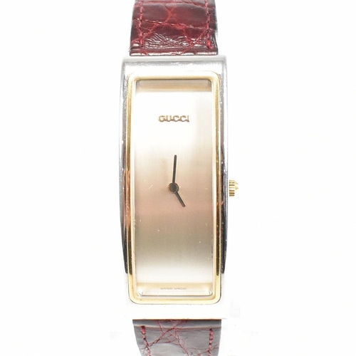 156 - A vintage Gucci wrist watch. The wrist watch model 52000 M 0001145 having a plain champagne convex d... 