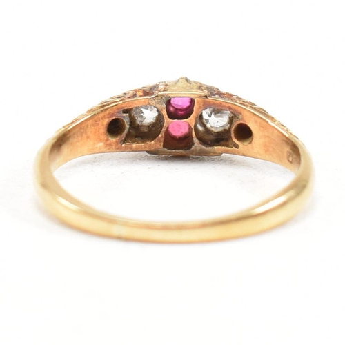 16 - A hallmarked Victorian 18ct gold gem set ring. The ring set with rubies and diamonds with one paste ... 