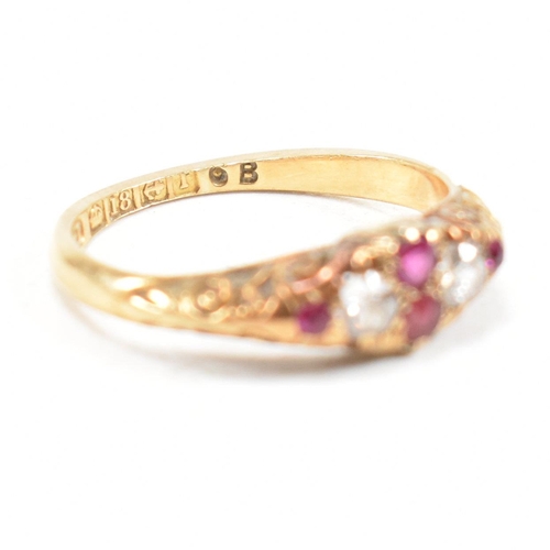 16 - A hallmarked Victorian 18ct gold gem set ring. The ring set with rubies and diamonds with one paste ... 