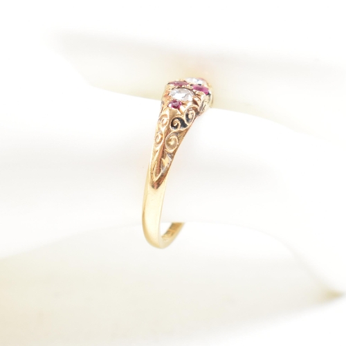 16 - A hallmarked Victorian 18ct gold gem set ring. The ring set with rubies and diamonds with one paste ... 