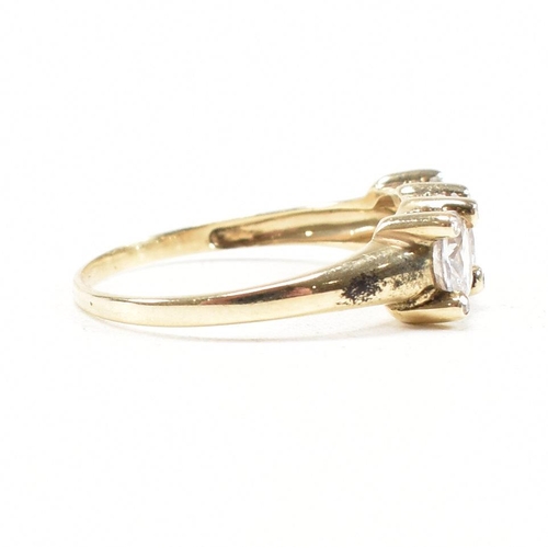 165 - A hallmarked 9ct gold and topaz three stone dress ring. Weight 2.6g. Size S.5. All weights, measurem... 