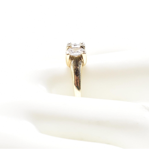 165 - A hallmarked 9ct gold and topaz three stone dress ring. Weight 2.6g. Size S.5. All weights, measurem... 