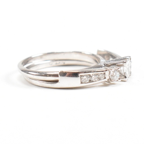 166 - A white gold and diamond stacking ring. Stamped 14k. Weight approx 4g. Size approx L. All weights, m... 