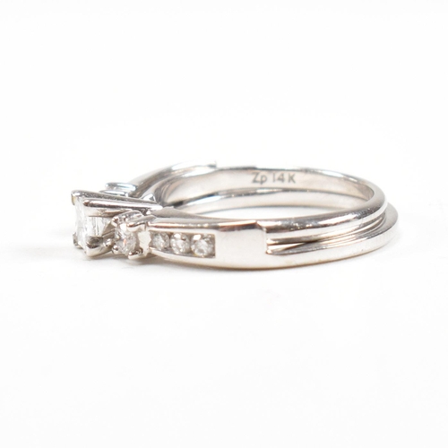 166 - A white gold and diamond stacking ring. Stamped 14k. Weight approx 4g. Size approx L. All weights, m... 