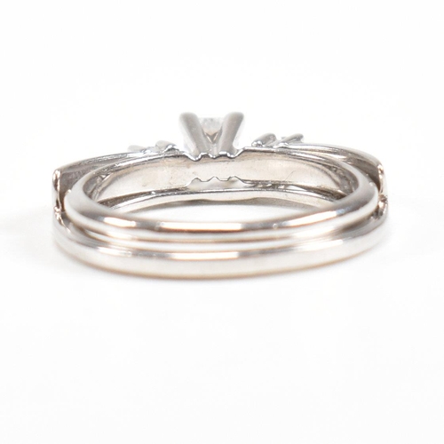 166 - A white gold and diamond stacking ring. Stamped 14k. Weight approx 4g. Size approx L. All weights, m... 